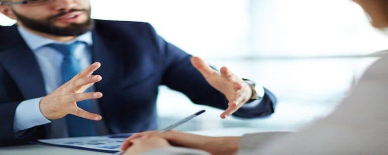 Manager showing estimated earning growth to his colleague