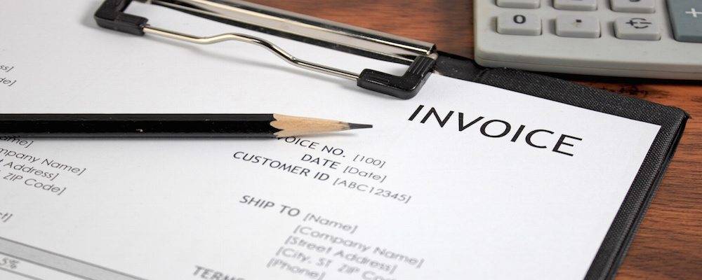 Invoice letter head on wood table / selective focus
